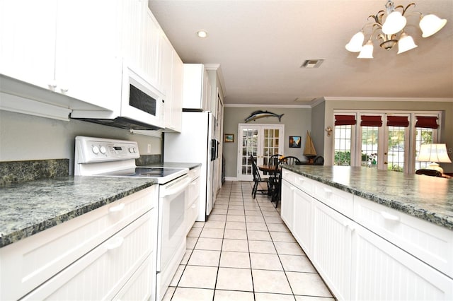 kitchen featuring white appliances, ornamental molding, french doors, and white cabinets