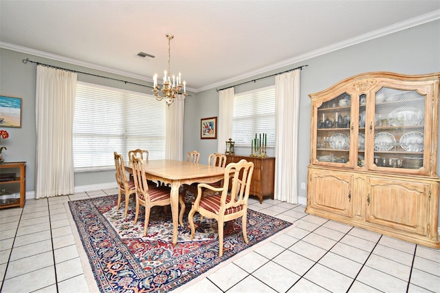 tiled dining area with ornamental molding and a notable chandelier