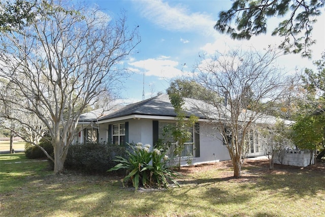 view of property exterior featuring a yard