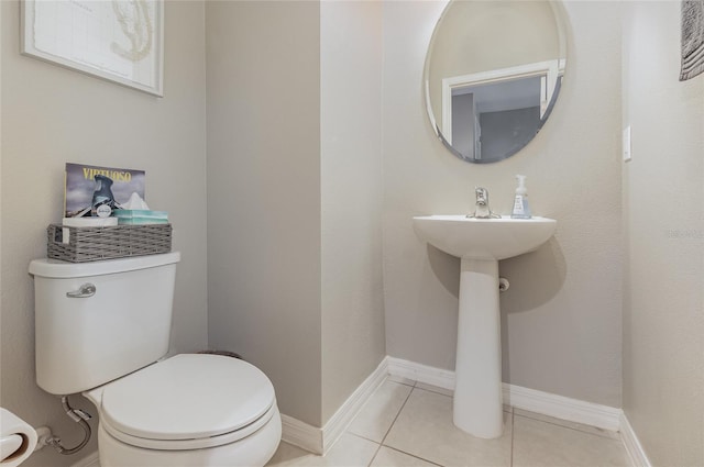 bathroom featuring tile patterned floors and toilet