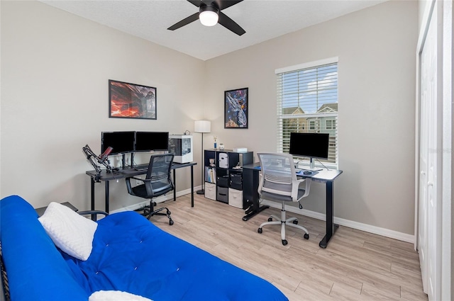 office area with ceiling fan and light hardwood / wood-style flooring