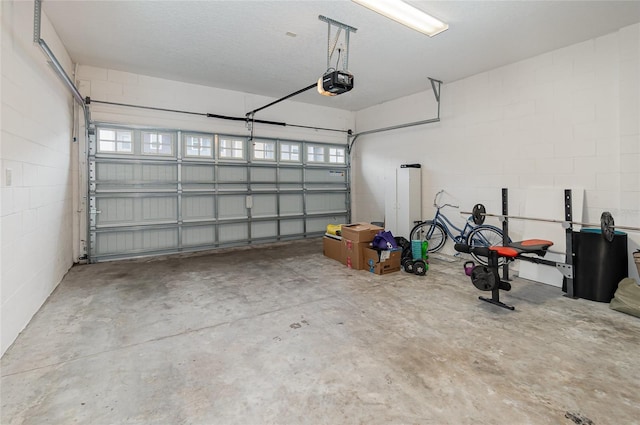 garage featuring a garage door opener