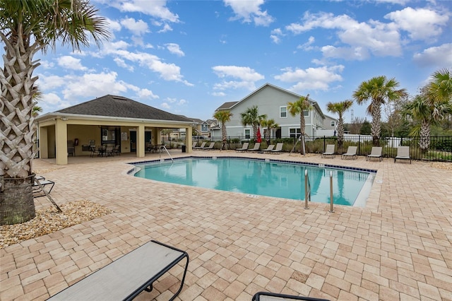 view of swimming pool with a patio