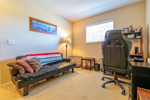 home office featuring carpet flooring and a textured ceiling