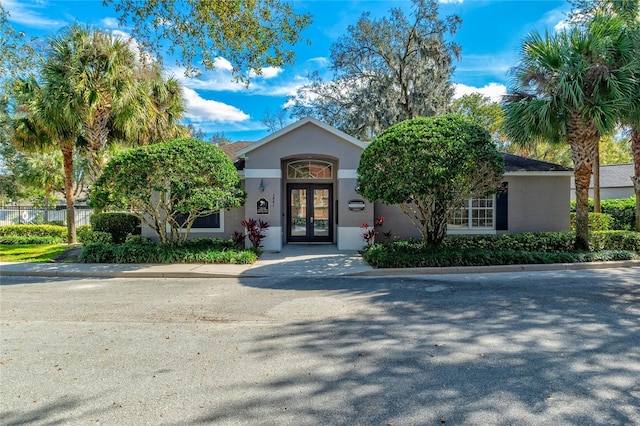 view of front of house featuring french doors and stucco siding