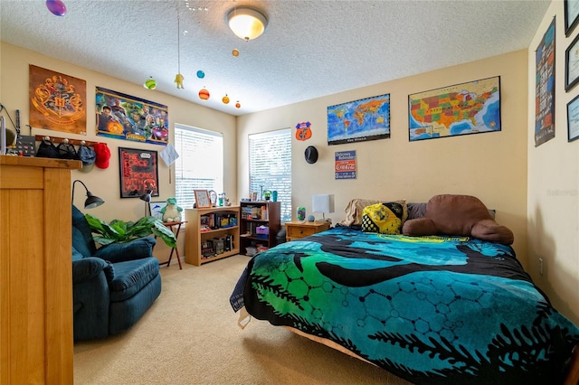 carpeted bedroom with a textured ceiling