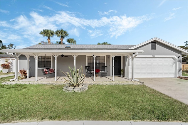 single story home featuring a garage, covered porch, and a front lawn