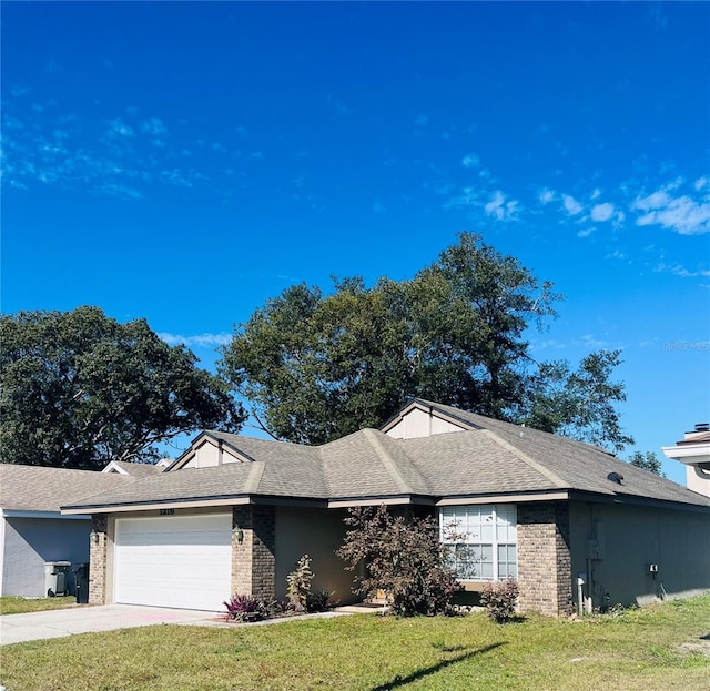 ranch-style home with a garage and a front lawn