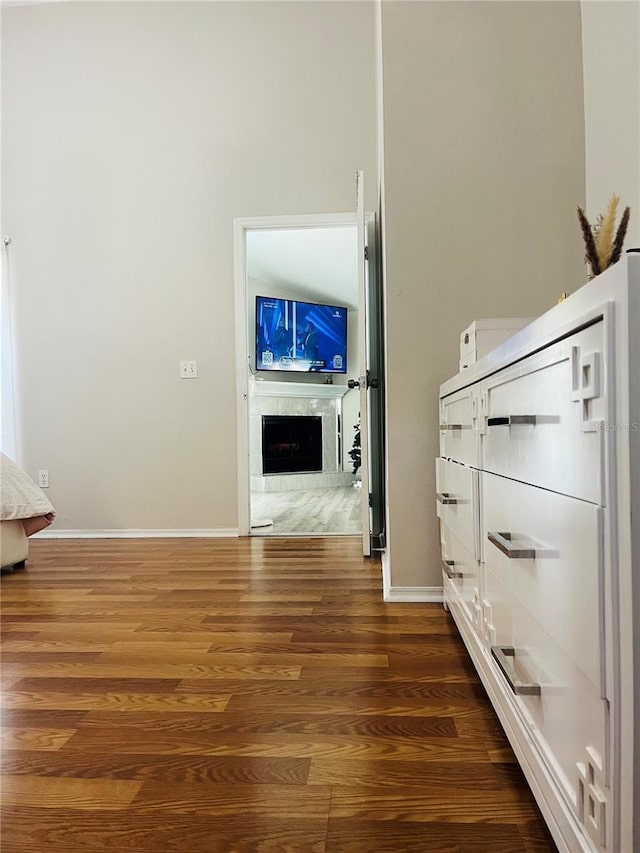 hallway with dark hardwood / wood-style floors