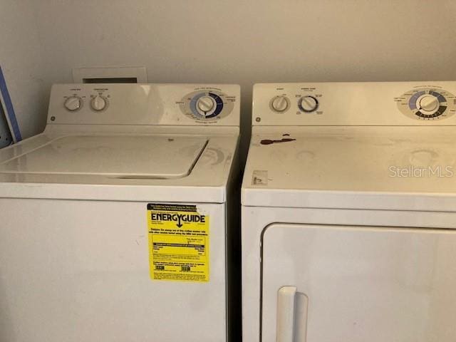 laundry room with independent washer and dryer