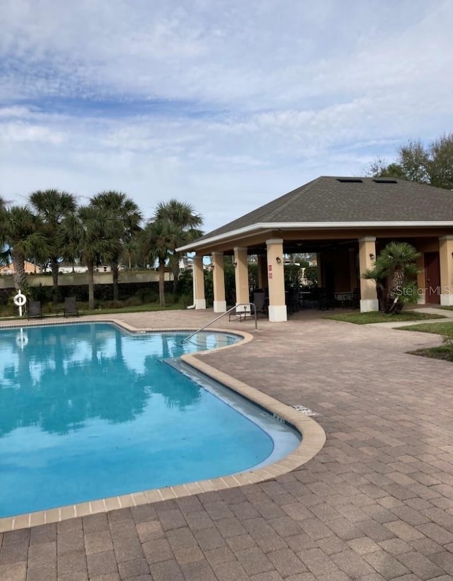 view of swimming pool with a patio area