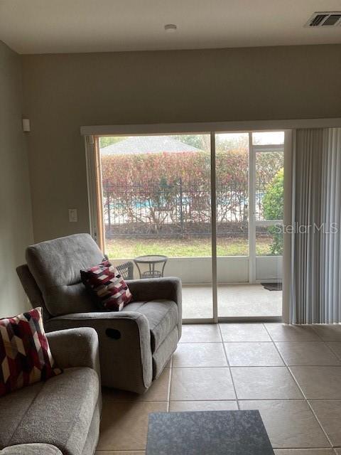 sitting room with light tile patterned flooring