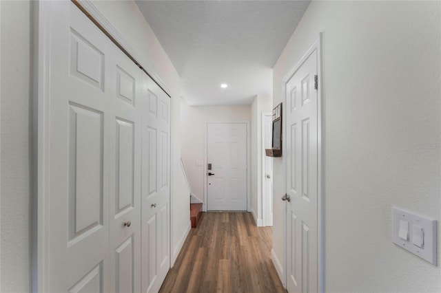 hallway with dark wood-type flooring