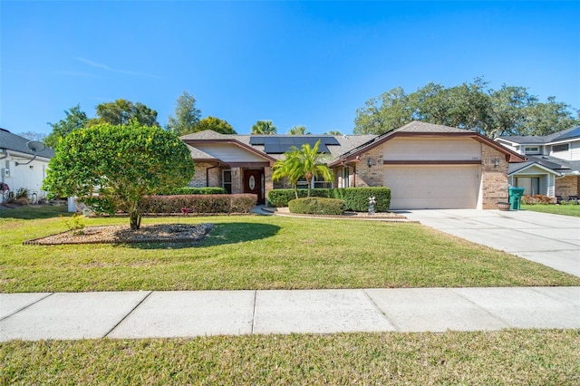 1107 Seafarer Ln, Winter Springs, FL 32708 - view of front facade featuring a garage, a front yard, and solar panels