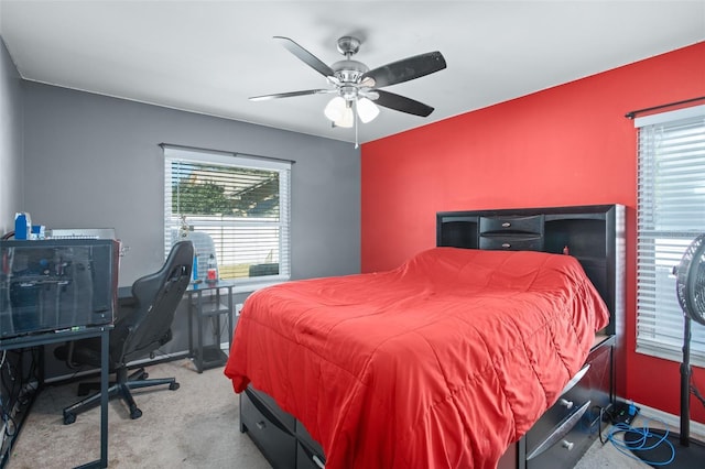 bedroom with ceiling fan and light colored carpet