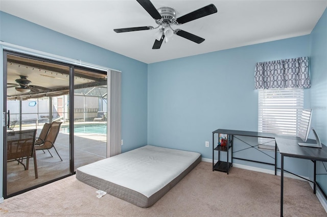 bedroom with light carpet, access to outside, and ceiling fan