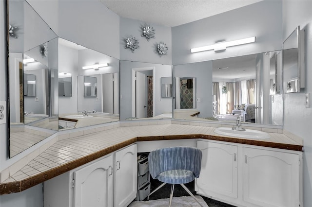 bathroom featuring vanity and a textured ceiling