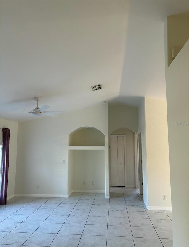 unfurnished room with light tile patterned flooring and ceiling fan