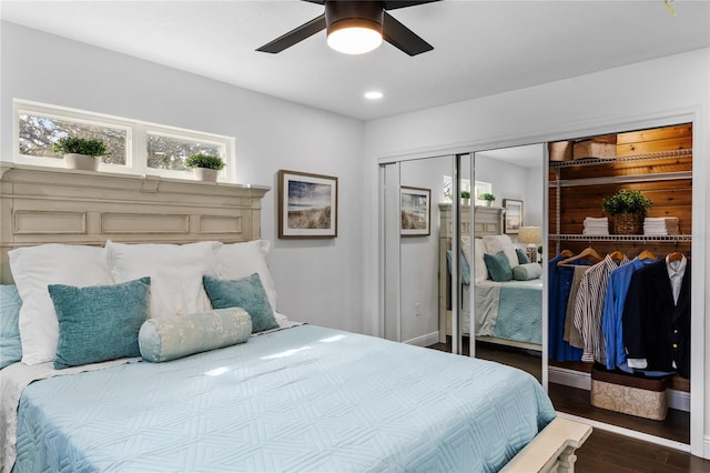 bedroom with ceiling fan, dark hardwood / wood-style flooring, and a closet