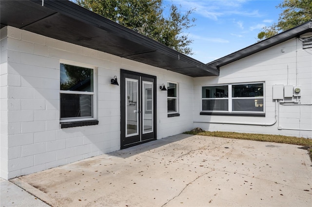 property entrance with a patio