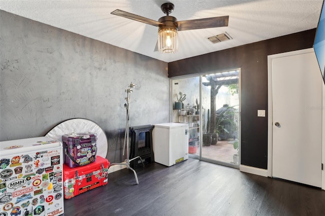 interior space featuring ceiling fan and hardwood / wood-style floors