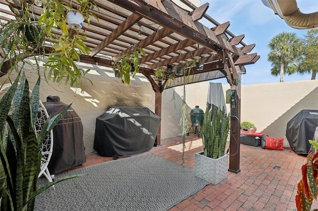 view of patio / terrace with grilling area and a pergola