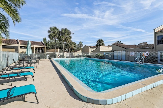 view of swimming pool with a patio area