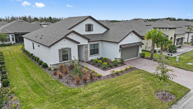 view of front of house with a garage and a front yard