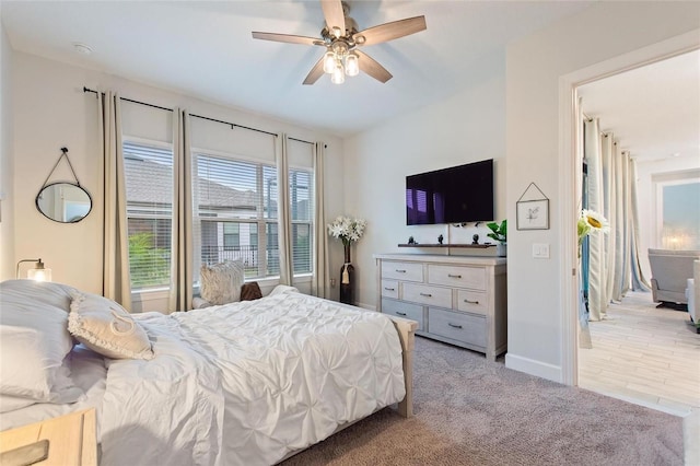 carpeted bedroom featuring ceiling fan