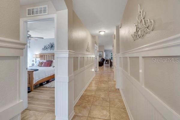 hallway with light tile patterned floors