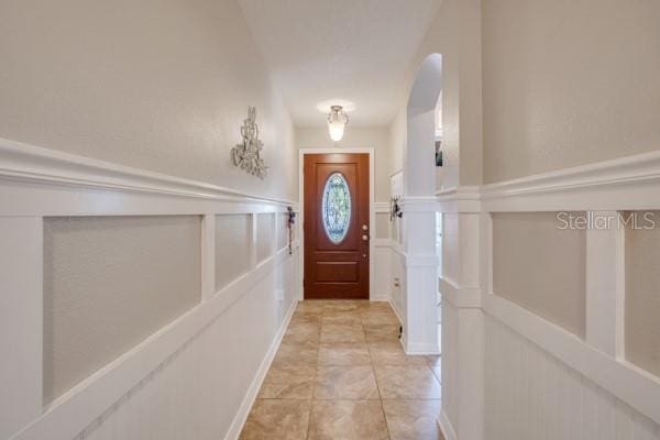 entryway featuring light tile patterned floors