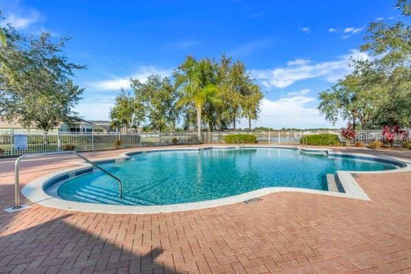 view of swimming pool with a patio