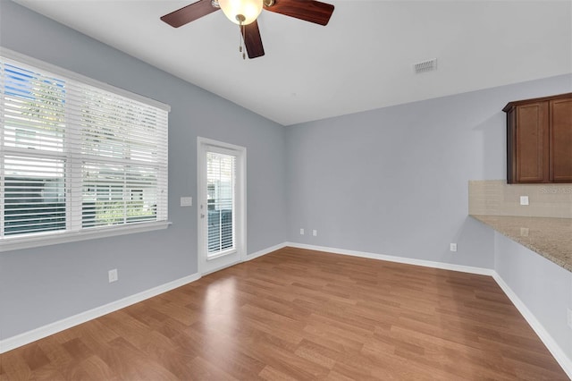 interior space with ceiling fan and light hardwood / wood-style floors