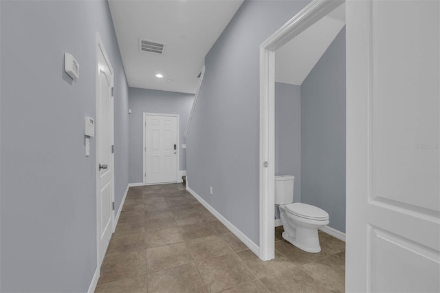 hallway featuring light tile patterned flooring