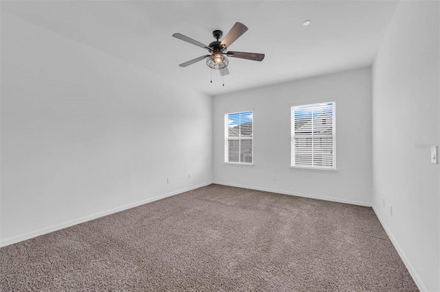 carpeted empty room with ceiling fan