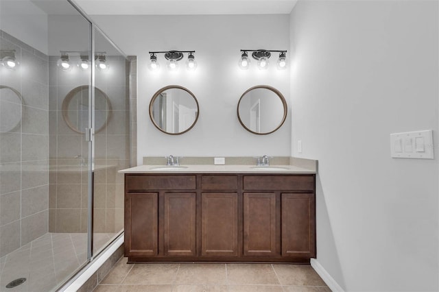 bathroom with vanity, tile patterned flooring, and walk in shower