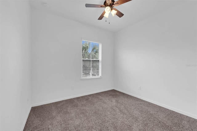 spare room with carpet floors and ceiling fan