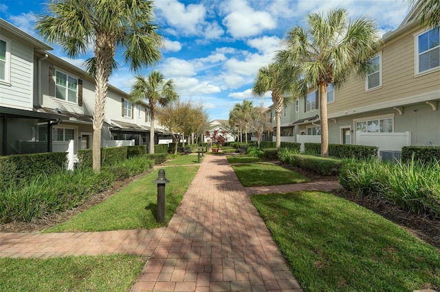 view of property's community with a yard