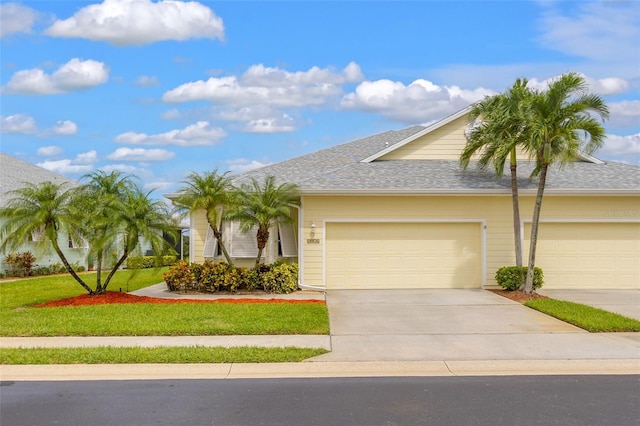 view of front facade featuring a garage and a front yard