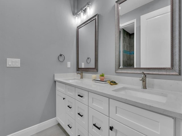 bathroom with tile patterned flooring and vanity