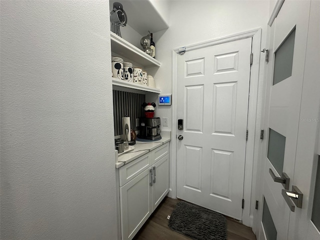 mudroom with dark hardwood / wood-style floors