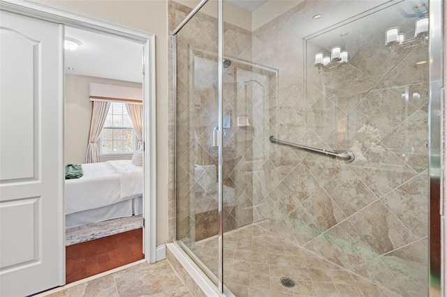 bathroom featuring tile patterned floors and a shower with shower door