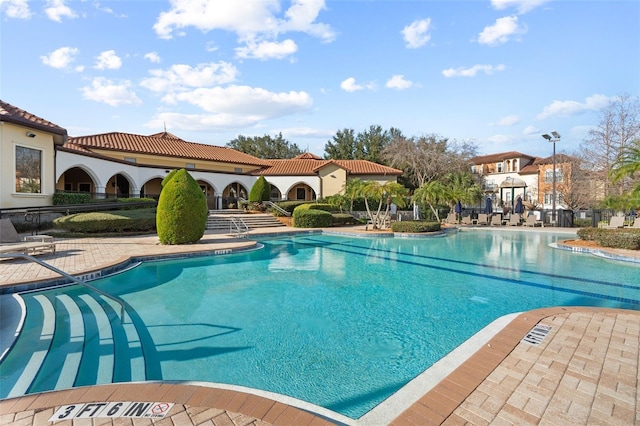 view of swimming pool with a patio