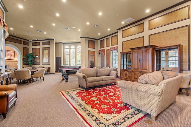 living room featuring crown molding, pool table, a high ceiling, and carpet flooring