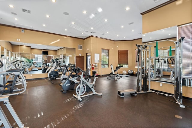 workout area featuring ornamental molding