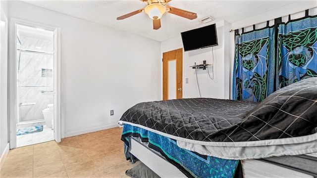 bedroom featuring ceiling fan, ensuite bath, and a textured ceiling