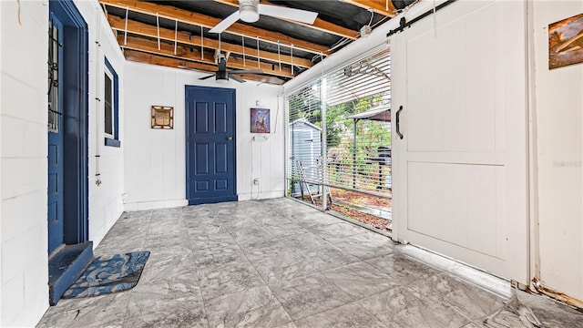 interior space featuring ceiling fan