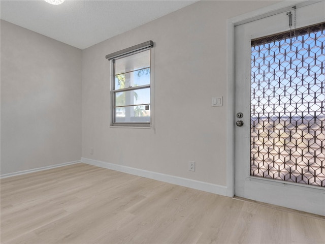 spare room with light wood-type flooring