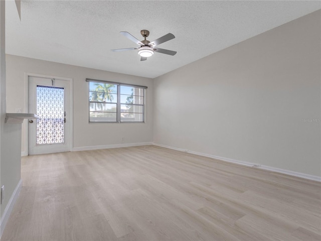 unfurnished room featuring ceiling fan, a textured ceiling, and light wood-type flooring