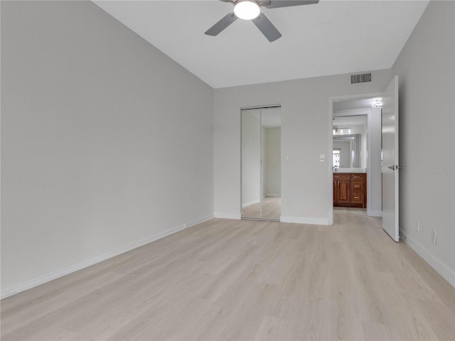 unfurnished bedroom featuring light wood-type flooring and ceiling fan